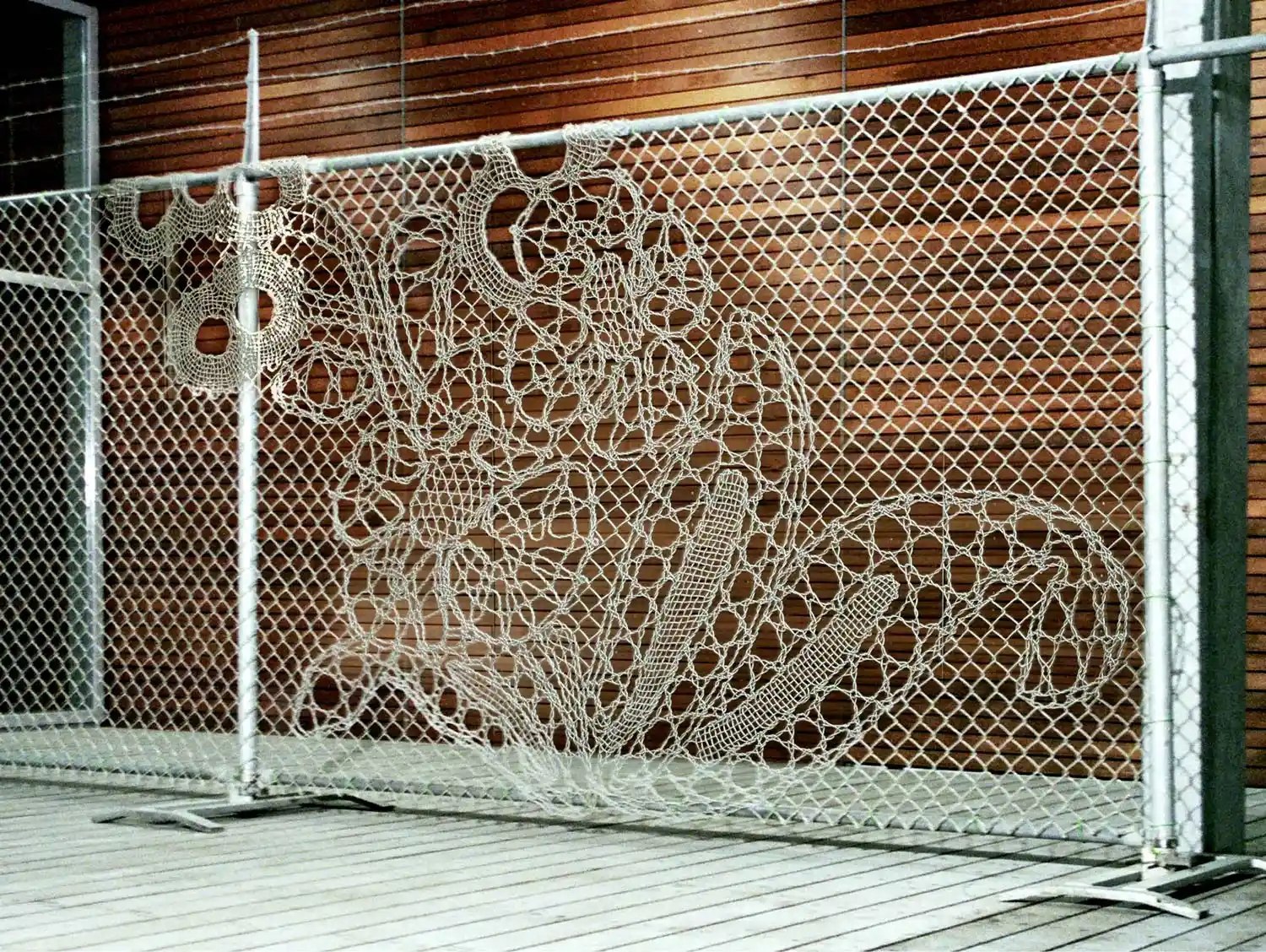 Intricate lace mesh privacy screen on deck balcony